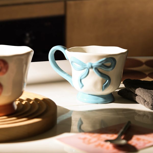 Wholesale Ceramic Coffee Cups with 3D Bowknot Embossed Ribbon Decoration