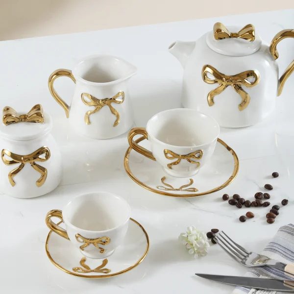 Wholesale Ceramic Dinnerware Set with Golden Bowknot Detailing, Suitable for Hotels, Cafes, and as Gift Sets